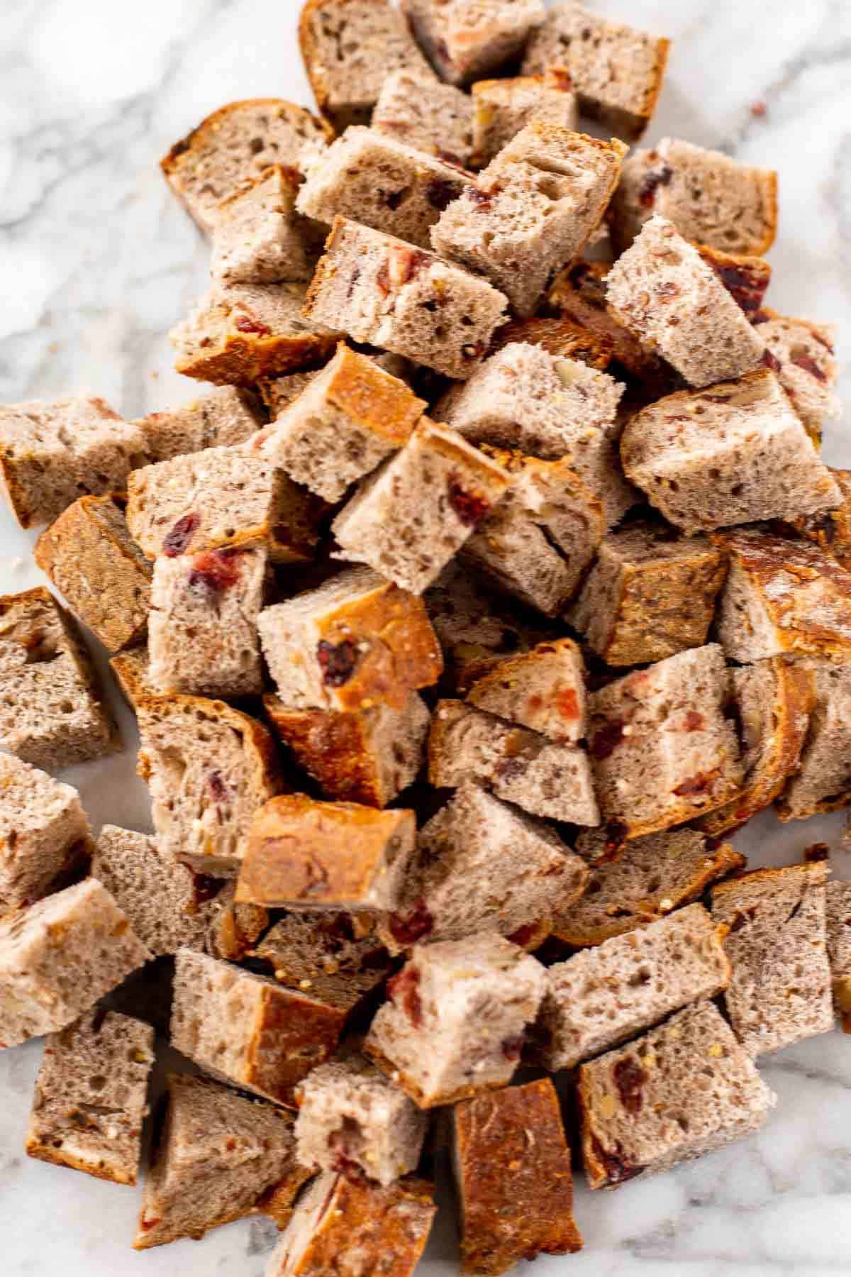 Cranberry Apple Walnut Stuffing is a cozy holiday side with apples, cranberries, herbs, and toasted bread baked until golden and delicious. | aheadofthyme.com