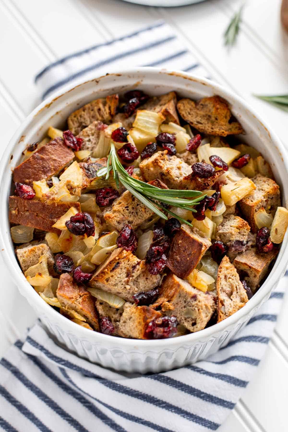 Cranberry Apple Walnut Stuffing is a cozy holiday side with apples, cranberries, herbs, and toasted bread baked until golden and delicious. | aheadofthyme.com