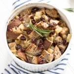 Cranberry walnut bread paired with sautéed apples, onions and rosemary is exactly what your holiday table needs! Hello cranberry walnut apple stuffing! | aheadofthyme.com