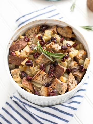 Cranberry walnut bread paired with sautéed apples, onions and rosemary is exactly what your holiday table needs! Hello cranberry walnut apple stuffing! | aheadofthyme.com