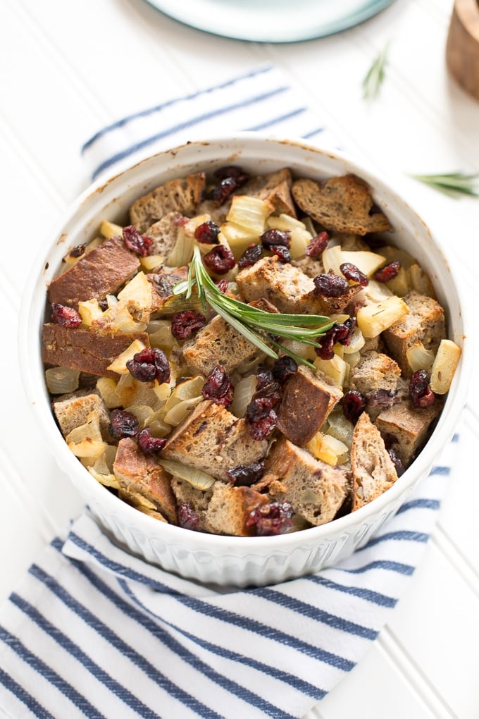 Cranberry walnut bread paired with sautéed apples, onions and rosemary is exactly what your holiday table needs! Hello cranberry walnut apple stuffing! | aheadofthyme.com