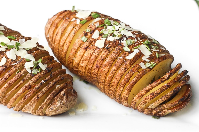 Hasselback potatoes with garlic herb butter are perfectly crispy on the outside and tender and buttery on the inside, infused with garlic and rosemary. | aheadofthyme.com