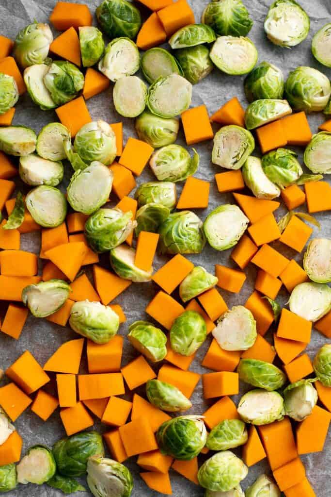 Maple Roasted Brussels Sprouts and Butternut Squash are a quick, easy, flavorful, and delicious Thanksgiving side dish that you need this holiday season. | aheadofthyme.com