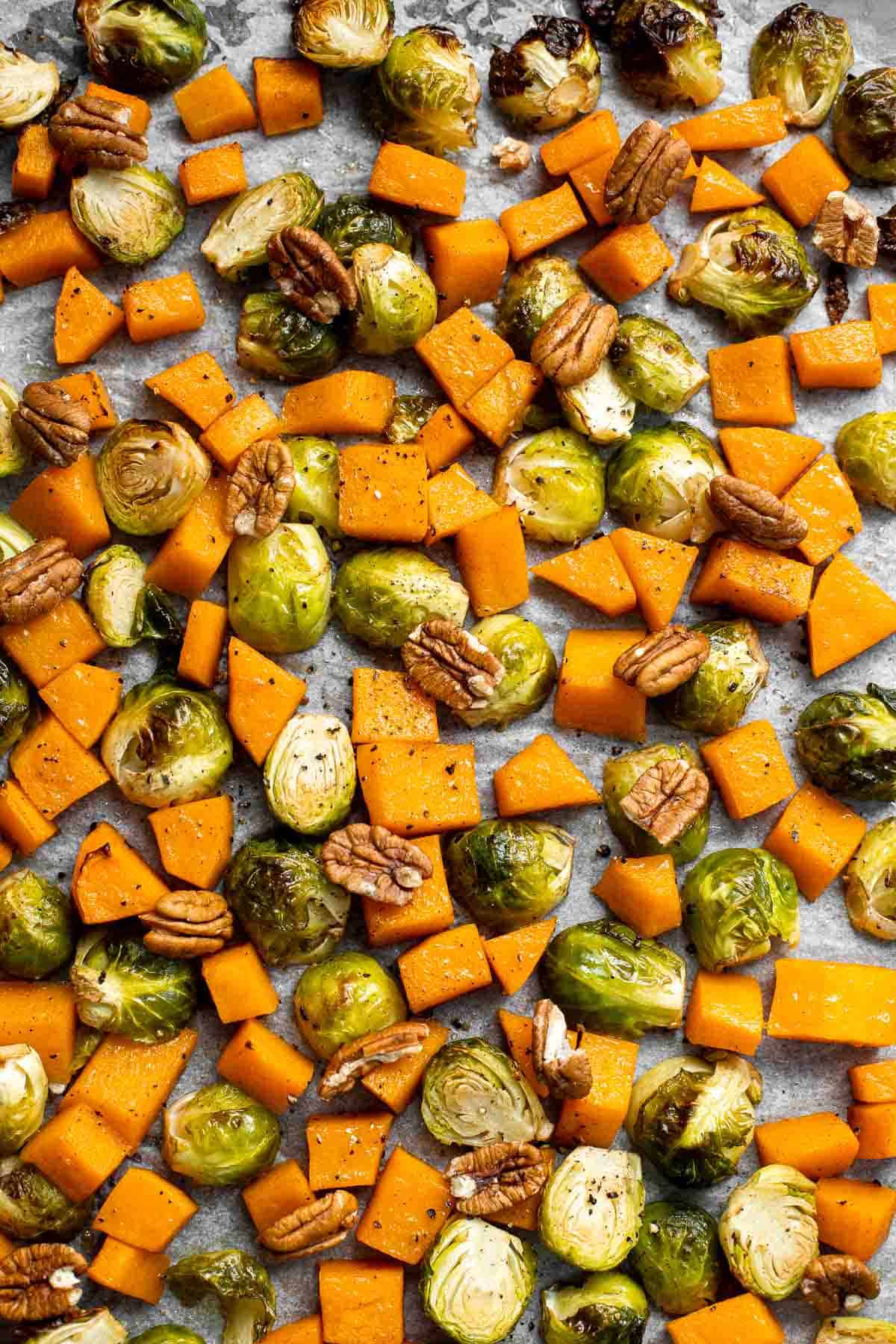 Maple Roasted Brussels Sprouts and Butternut Squash are a quick, easy, flavorful, and delicious Thanksgiving side dish that you need this holiday season. | aheadofthyme.com