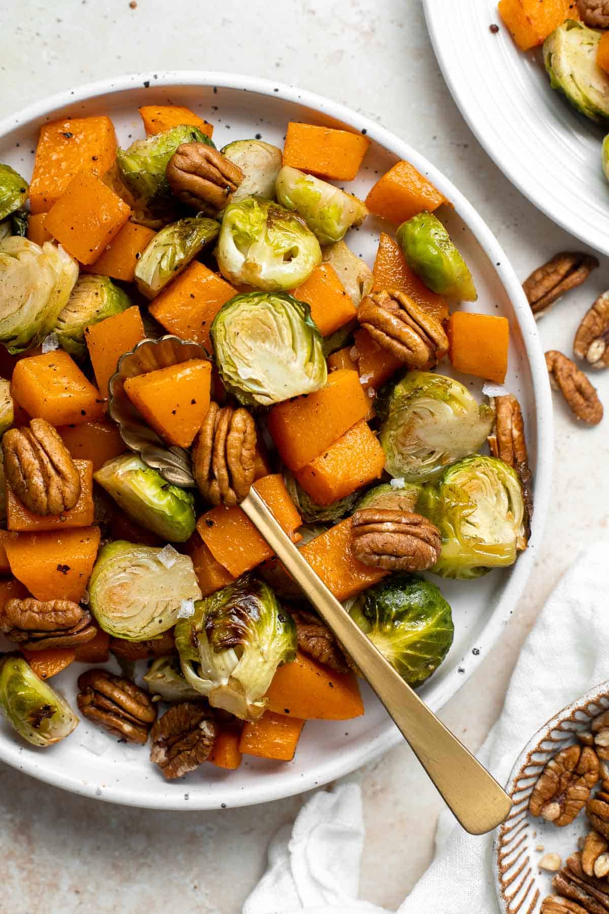 Maple Roasted Brussels Sprouts and Butternut Squash are a quick, easy, flavorful, and delicious Thanksgiving side dish that you need this holiday season. | aheadofthyme.com
