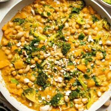 Creamy Pumpkin Curry is made with fresh pumpkin, chickpeas, broccoli, and cashews in a fragrant red coconut curry sauce. It's vegan and gluten-free too! | aheadofthyme.com