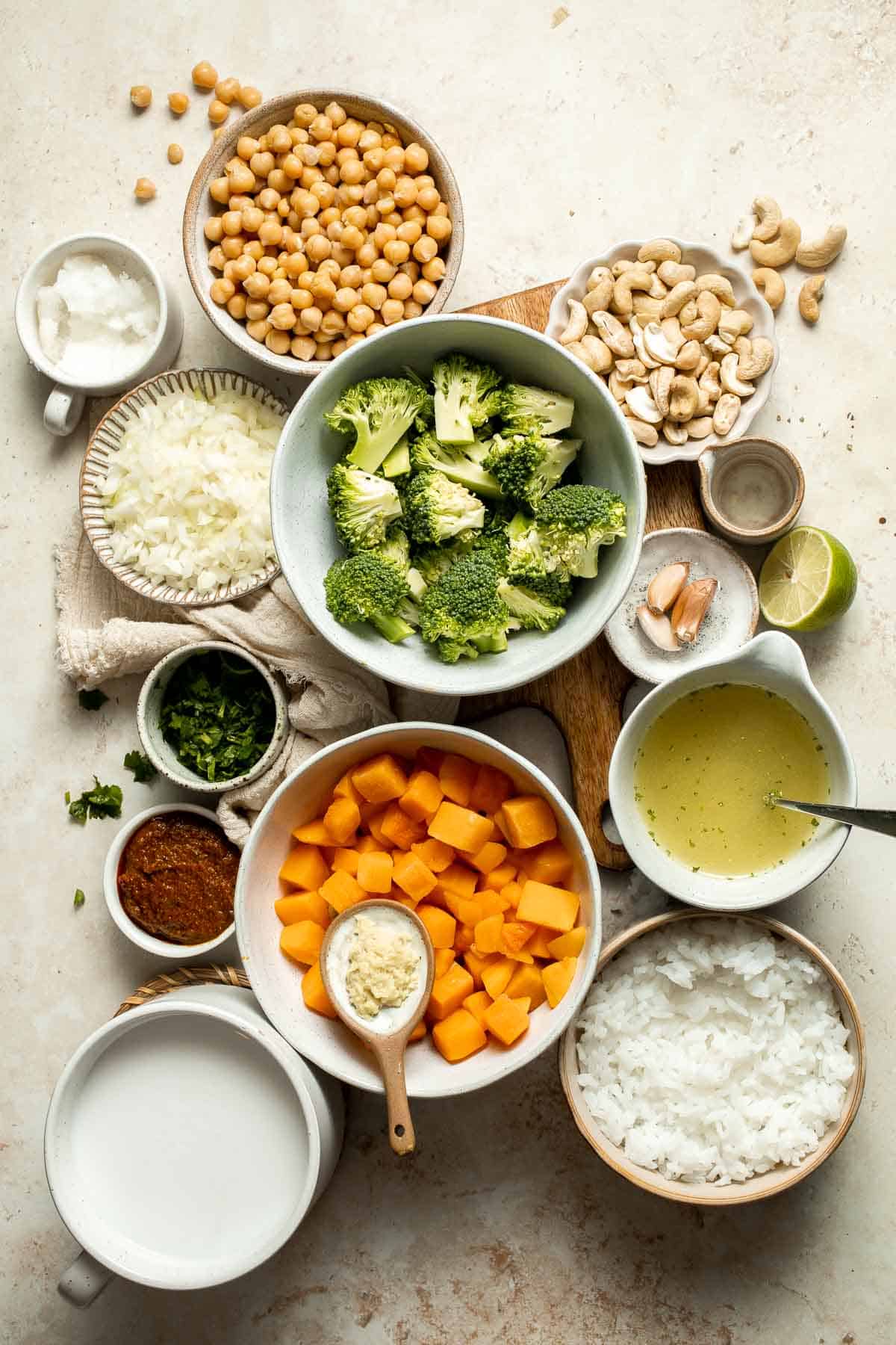 Creamy Pumpkin Curry is made with fresh pumpkin, chickpeas, broccoli, and cashews in a fragrant red coconut curry sauce. It's vegan and gluten-free too! | aheadofthyme.com