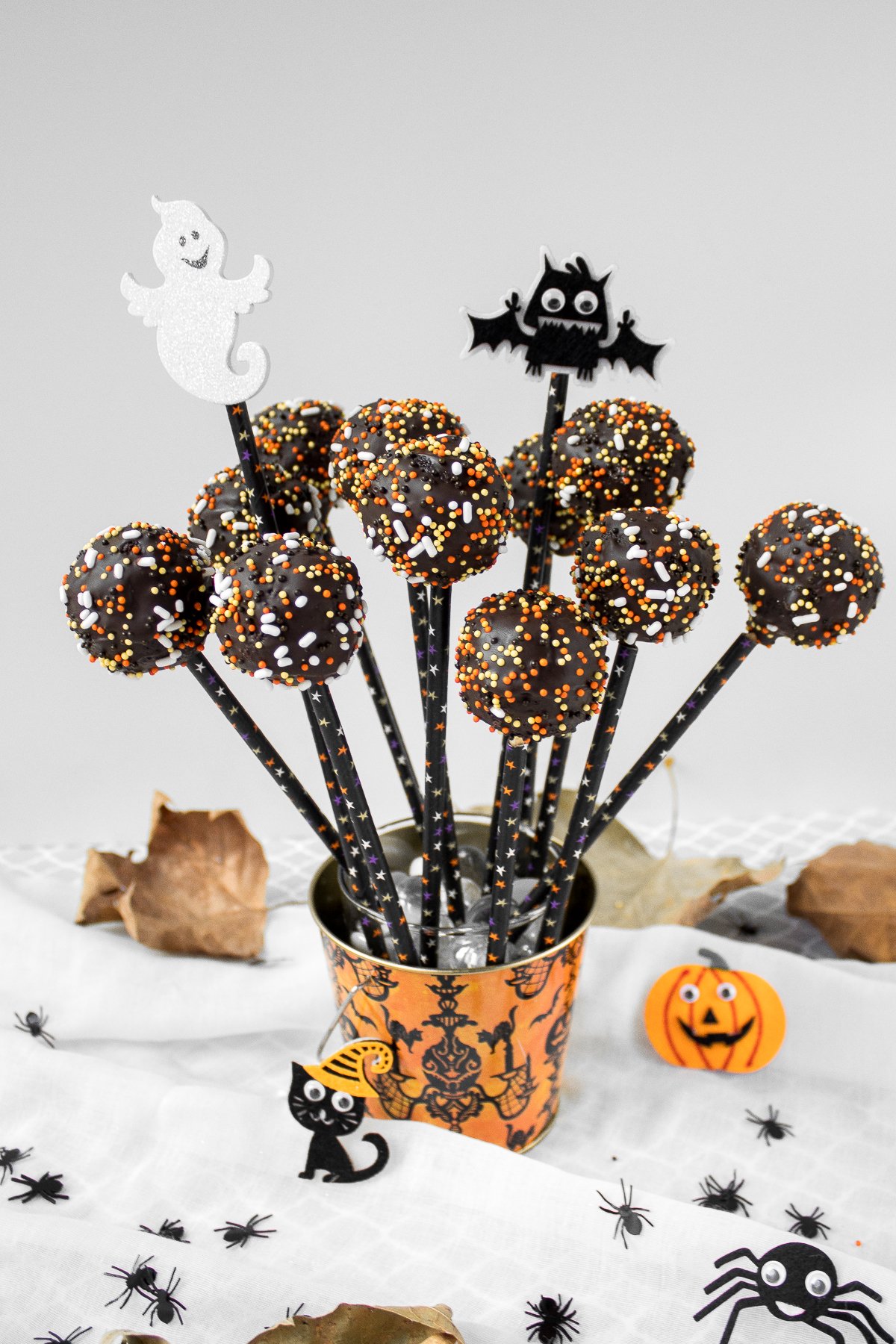 Trick or Treat! Easy to make and decorate, bite-sized spooky chocolate cake pops packed with chocolate and sprinkles are the perfect Halloween treat. | aheadofthyme.com