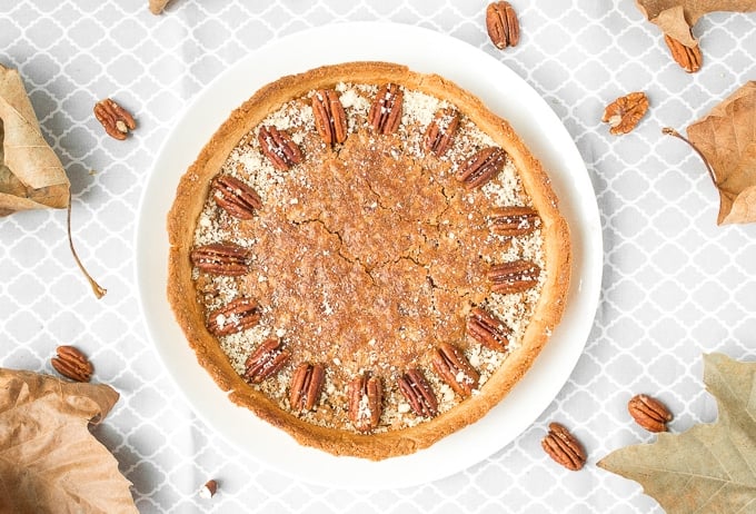 Give traditional pecan pie a twist this holiday season by using finely chopped pecans to create a smooth topping on this chopped pecan pie! | aheadofthyme.com