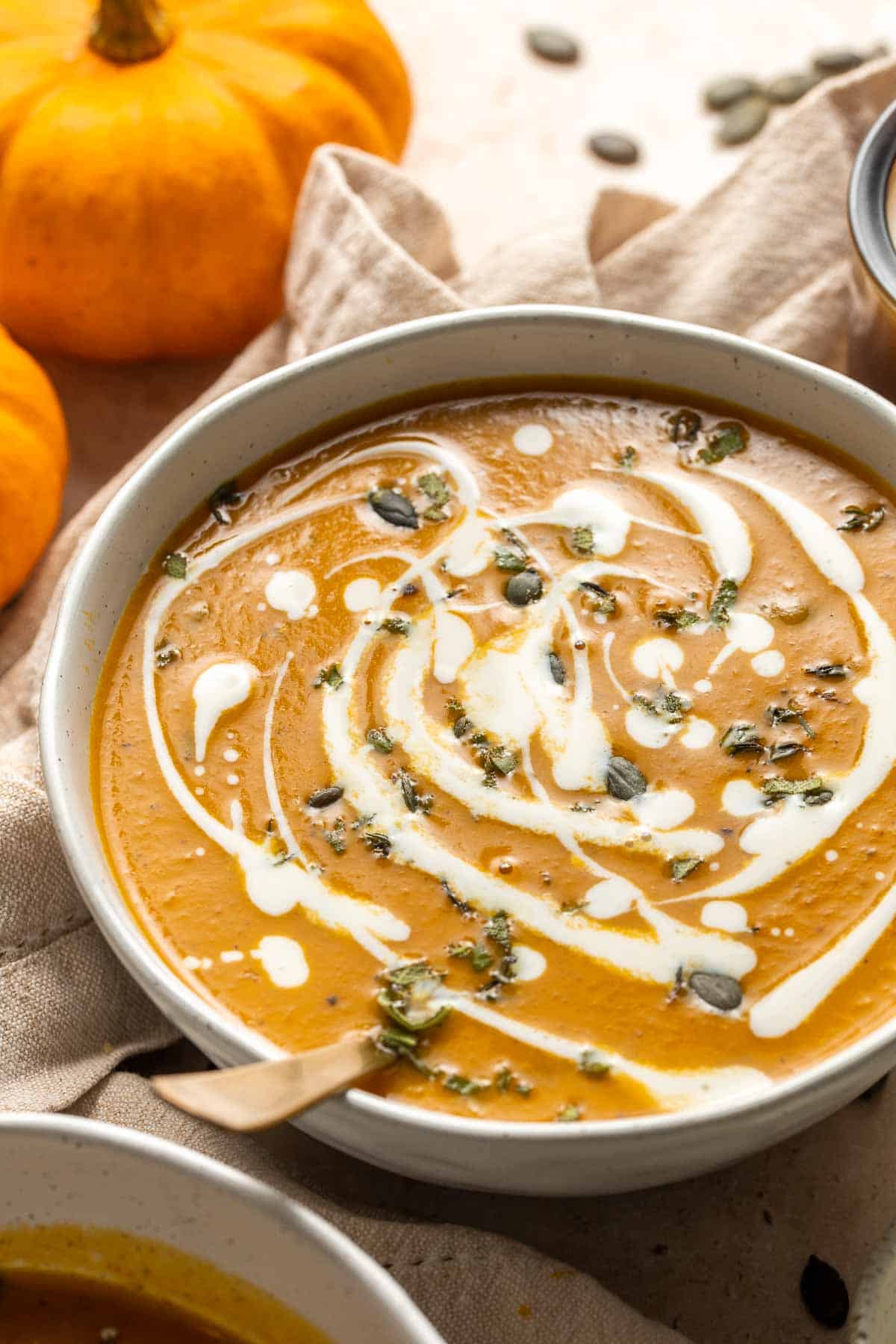 Coconut Curry Pumpkin Soup is rich, creamy, flavorful, and delicious. This vegan soup is ready just over 35 minutes with minimal prep and in one pot. | aheadofthyme.com