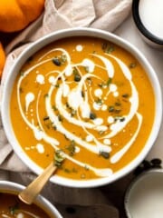 Coconut Curry Pumpkin Soup is rich, creamy, cozy, and flavorful. This easy vegan recipe is ready in just 35 minutes with minimal prep, all in one pot. | aheadofthyme.com