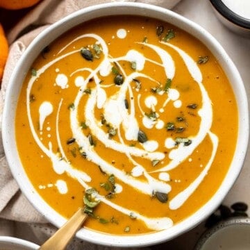 Coconut Curry Pumpkin Soup is rich, creamy, flavorful, and delicious. This vegan soup is ready just over 35 minutes with minimal prep and in one pot. | aheadofthyme.com