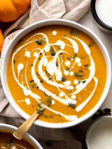 Coconut Curry Pumpkin Soup is rich, creamy, flavorful, and delicious. This vegan soup is ready just over 35 minutes with minimal prep and in one pot. | aheadofthyme.com