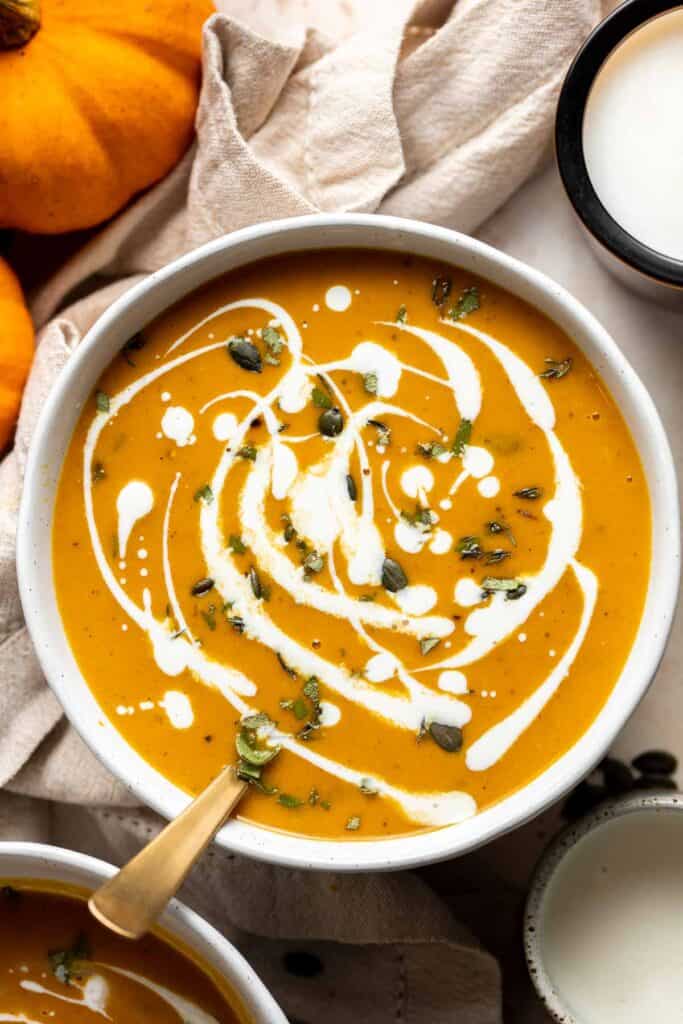 Coconut Curry Pumpkin Soup is rich, creamy, flavorful, and delicious. This vegan soup is ready just over 35 minutes with minimal prep and in one pot. | aheadofthyme.com