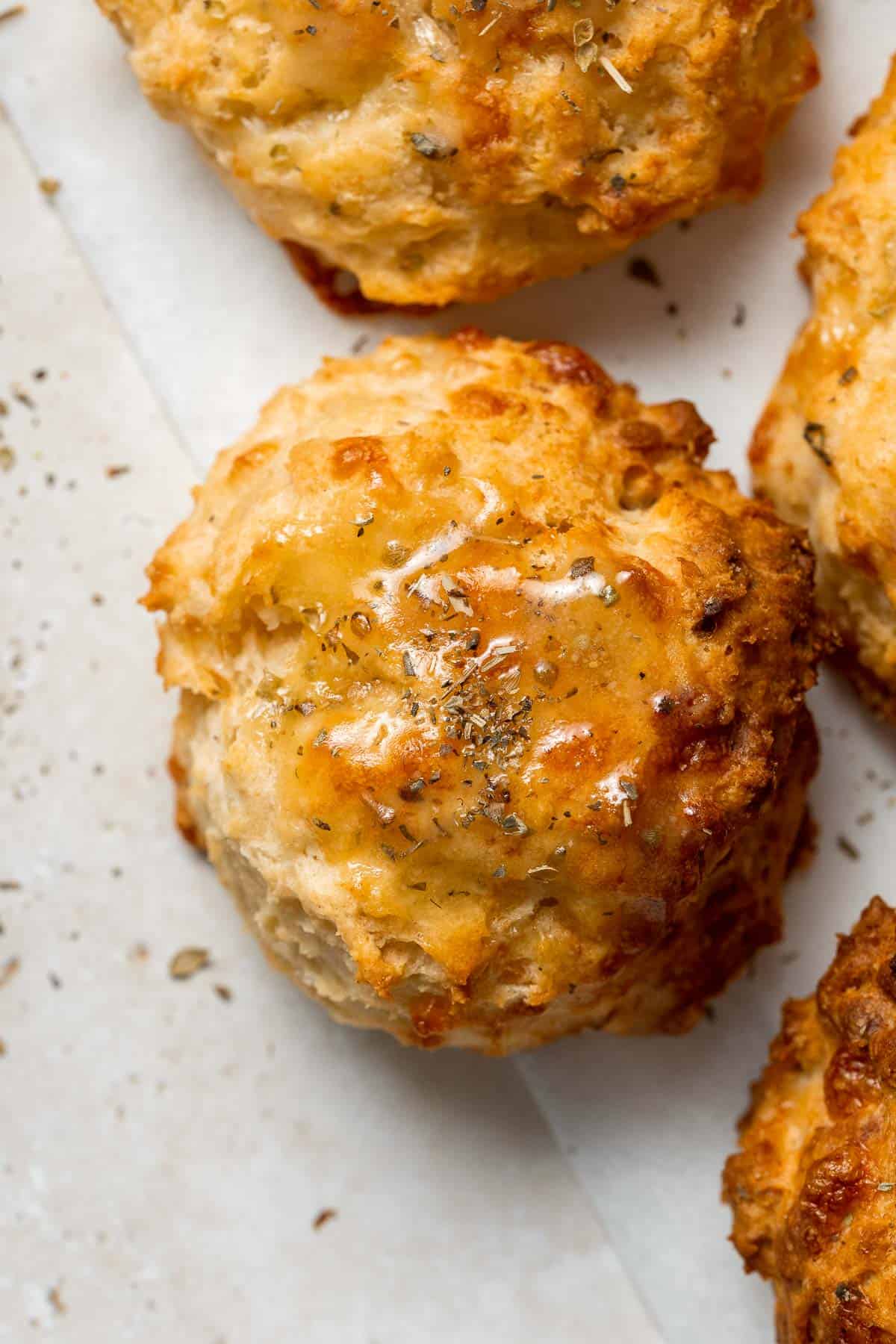 Flaky Garlic Cheddar Biscuits are a simple but delicious and flavorful no yeast bread that is ready for the oven with less than 15 minutes prep. | aheadofthyme.com