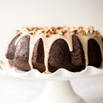 This showstopping festive gingerbread bundt cake with maple cinnamon glaze and pecans is moist, soft, and fluffy, and packed with warm holiday spices. | aheadofthyme.com