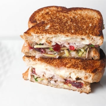 Looking for comfort food in a hand-held serving? Well, put those holiday leftovers to good use and make leftover Thanksgiving turkey sandwich with cranberry sauce! | aheadofthyme.com