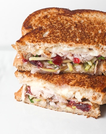 Looking for comfort food in a hand-held serving? Well, put those holiday leftovers to good use and make leftover Thanksgiving turkey sandwich with cranberry sauce! | aheadofthyme.com