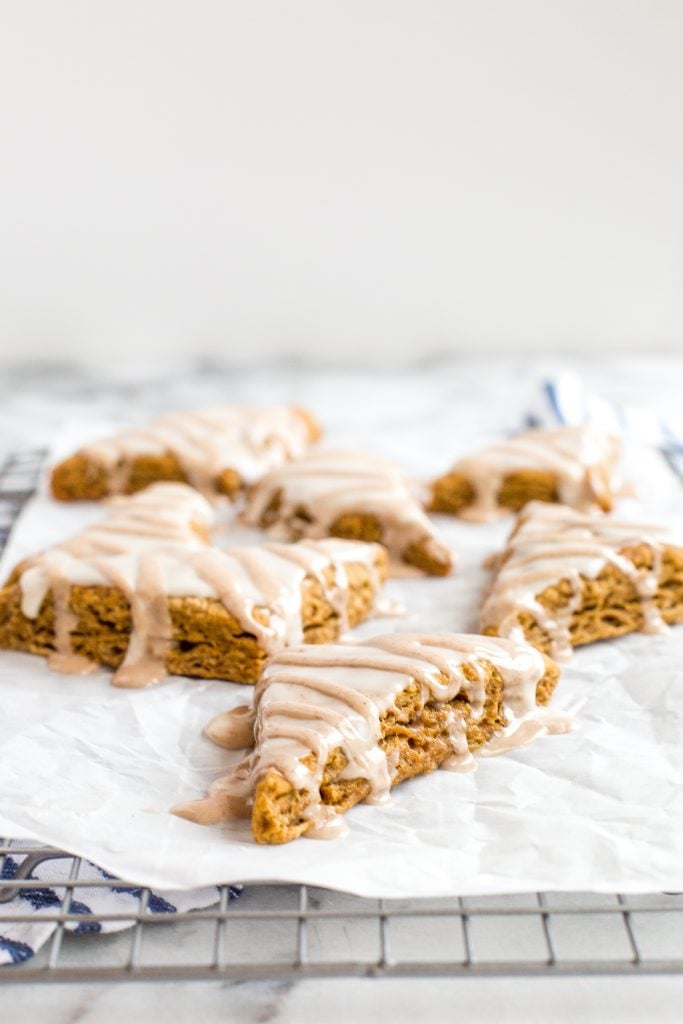 Quick and easy Starbucks inspired mini glazed pumpkin scones are the perfect little fall treat packed with pumpkin flavour and topped with two sweet glazes. | aheadofthyme.com