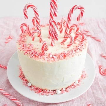 Looking for a showstopper at your next holiday party? Incorporate the minty taste of candy canes into this gorgeous, festive candy cane layered cake! | aheadofthyme.com