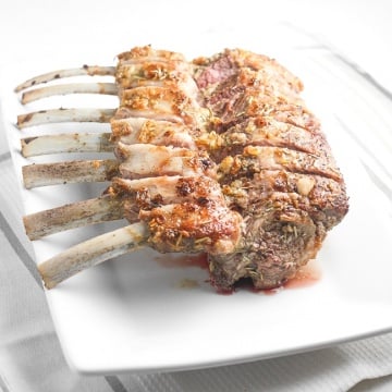 Ready in under 30 minutes, juicy and tender garlic rosemary rack of lamb is an exquisite dish bursting with incredible flavours in each and every bite. | aheadofthyme.com