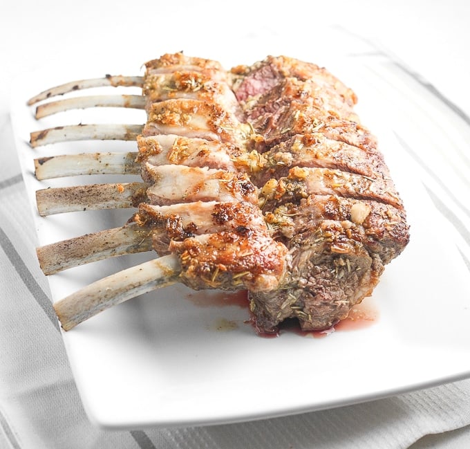 Ready in under 30 minutes, juicy and tender garlic rosemary rack of lamb is an exquisite dish bursting with incredible flavours in each and every bite. | aheadofthyme.com