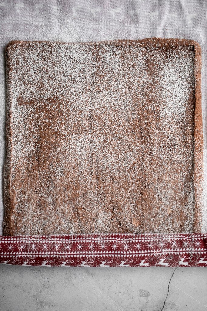 Holiday yule log cake (Bûche de Noël) with a chocolate sponge cake, whipped cream filling, and whipped chocolate ganache coating is a Christmas classic. | aheadofthyme.com