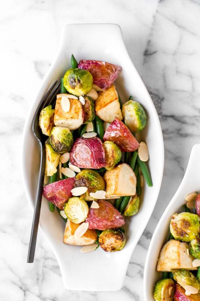 Roasted brussels sprouts salad with creamy potatoes, crispy string beans, tender brussels sprouts, is tossed in a delicious homemade dijon vinaigrette. | aheadofthyme.com