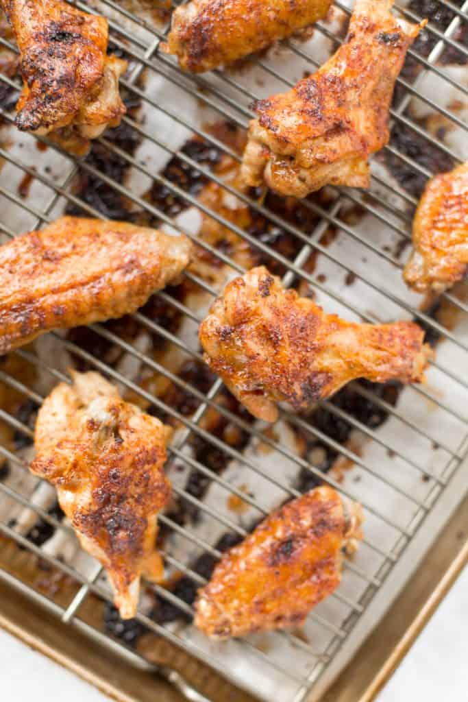 You will be amazed by how crispy these baked Asian chicken wings turn out! We add sriracha for heat, honey for sweetness, and ginger to balance the flavours. | aheadofthyme.com
