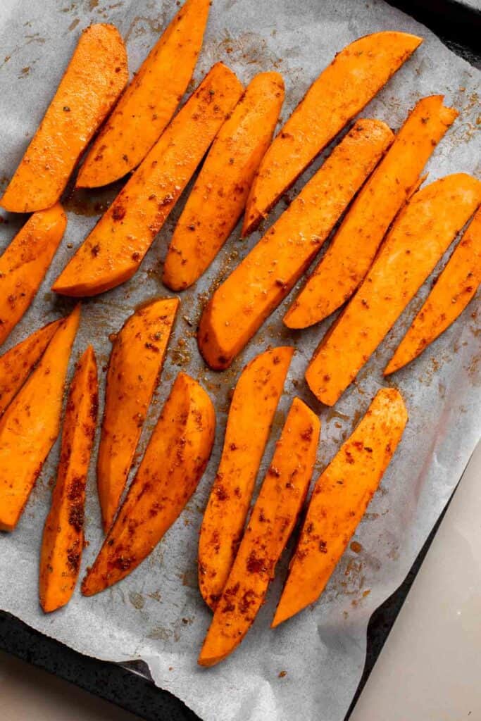 Baked Sweet Potato Wedges are crispy, delicious, flavorful. Serve as an appetizer or side dish. They are salty, savory, and sweet, with a hint of spice. | aheadofthyme.com