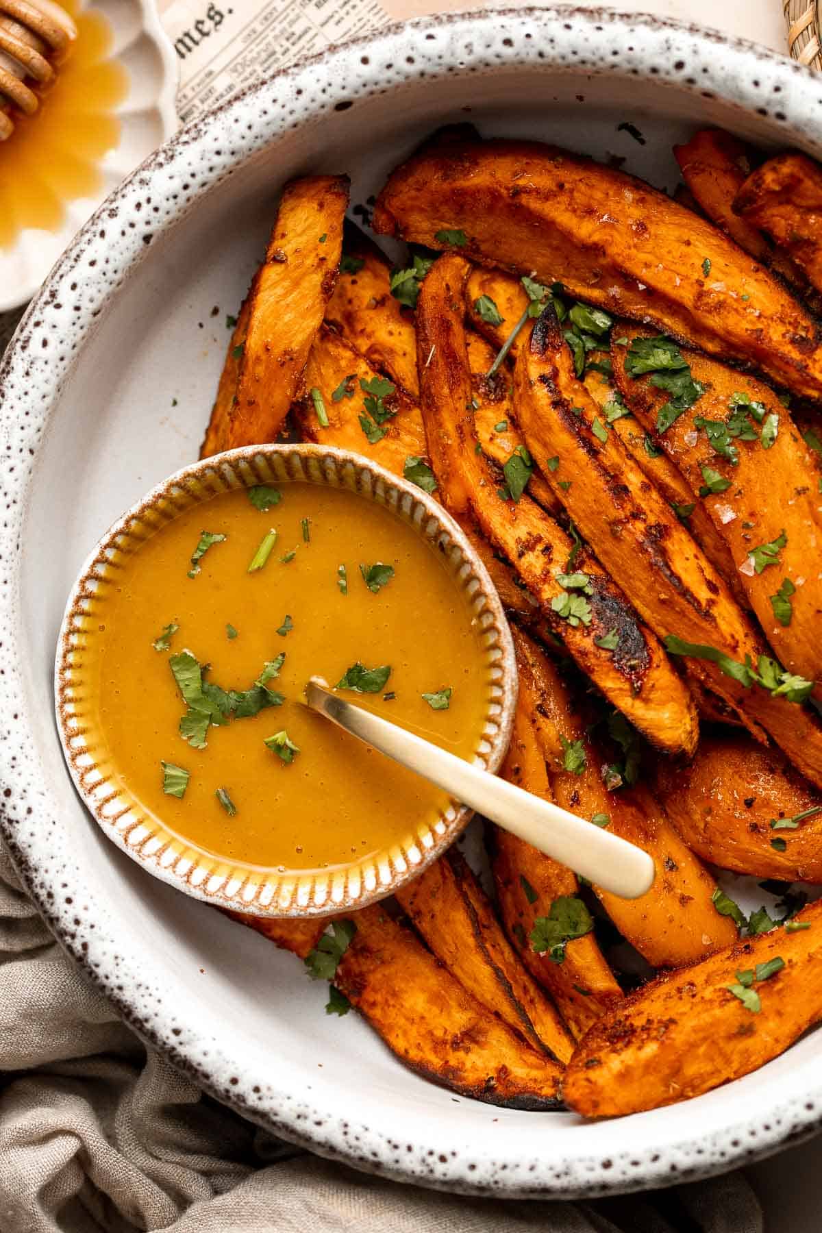 Baked Sweet Potato Wedges are crispy, delicious, flavorful. Serve as an appetizer or side dish. They are salty, savory, and sweet, with a hint of spice. | aheadofthyme.com