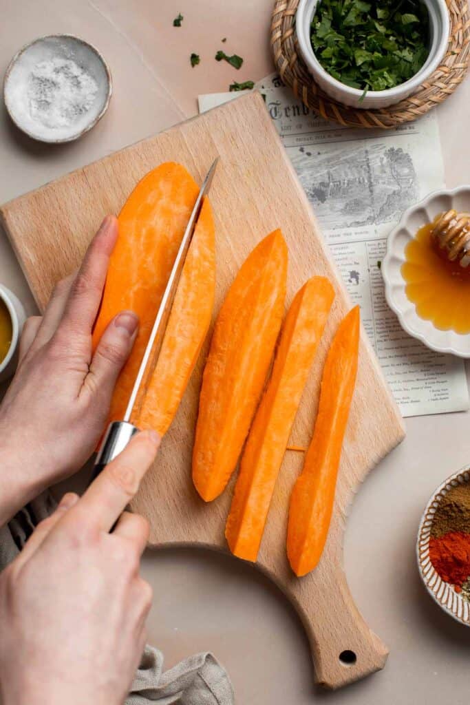 Baked Sweet Potato Wedges are crispy, delicious, flavorful. Serve as an appetizer or side dish. They are salty, savory, and sweet, with a hint of spice. | aheadofthyme.com