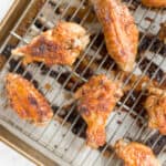 You will be amazed by how crispy these baked Asian chicken wings turn out! We add sriracha for heat, honey for sweetness, and ginger to balance the flavours. | aheadofthyme.com
