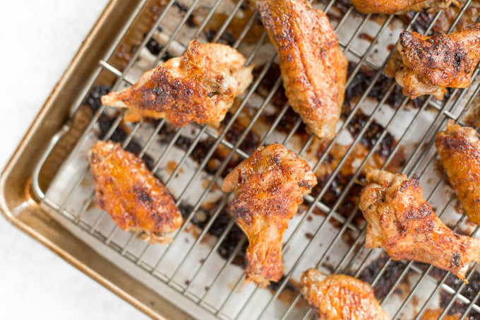 You will be amazed by how crispy these baked Asian chicken wings turn out! We add sriracha for heat, honey for sweetness, and ginger to balance the flavours. | aheadofthyme.com