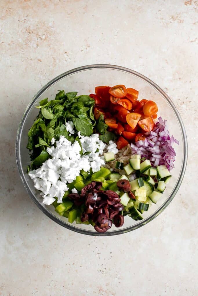 Mediterranean Brown Rice Salad loaded with veggies and tossed in a Greek dressing is filling, healthy, nutritious, gluten-free, and easy to make. | aheadofthyme.com