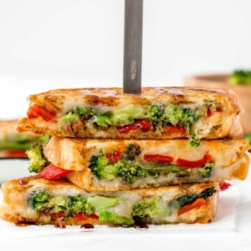 Take your grilled cheese game to the next level with Roasted Broccoli Grilled Cheese Sandwich made with broccoli, red peppers, cheddar, and mozzarella. | aheadofthyme.com