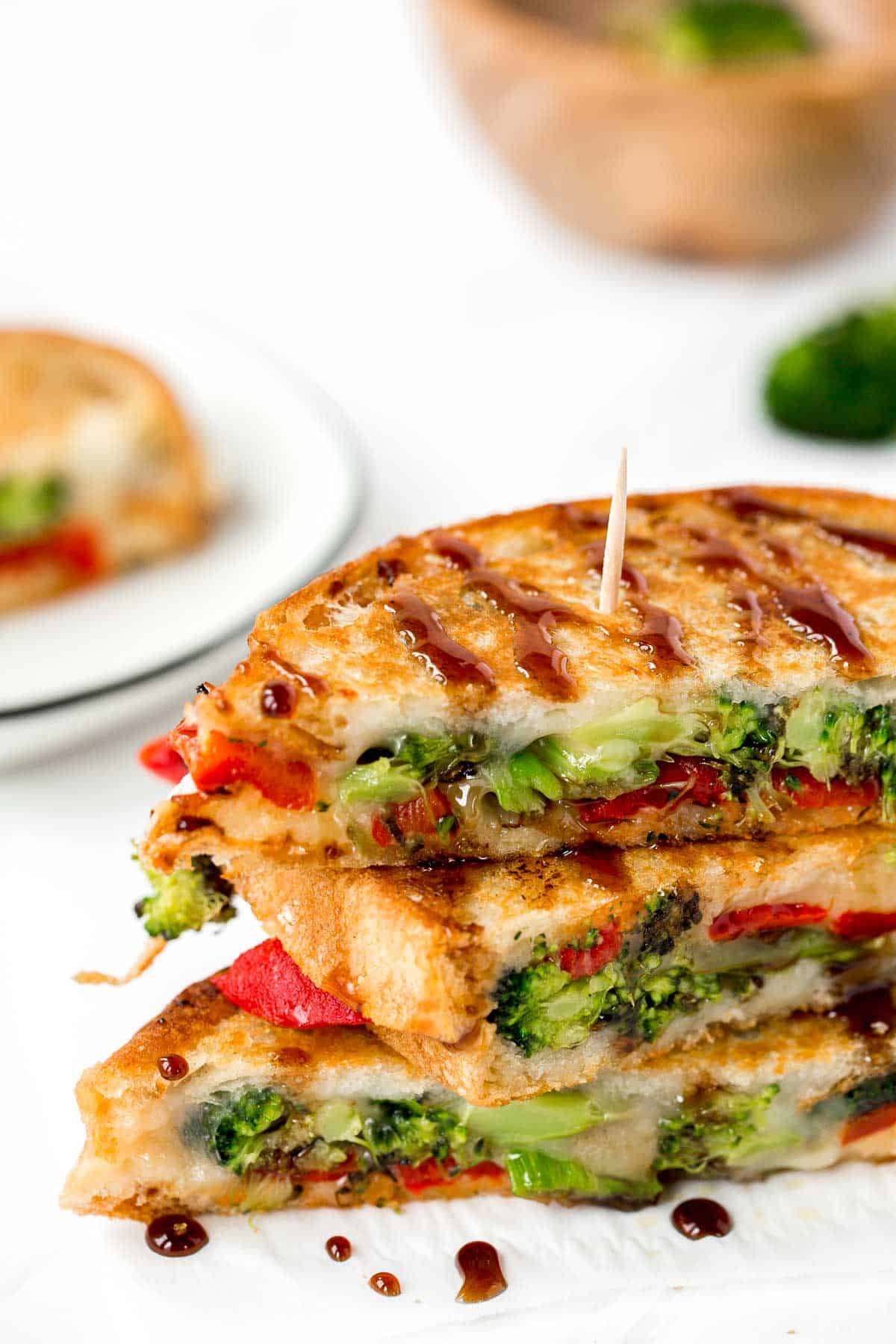 Take your grilled cheese game to the next level with Roasted Broccoli Grilled Cheese Sandwich made with broccoli, red peppers, cheddar, and mozzarella. | aheadofthyme.com