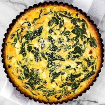 Spinach and feta quiche is healthy and gluten-free with a keto cauliflower crust and savoury vegetarian filling. Serve for breakfast, lunch or dinner. | aheadofthyme.com