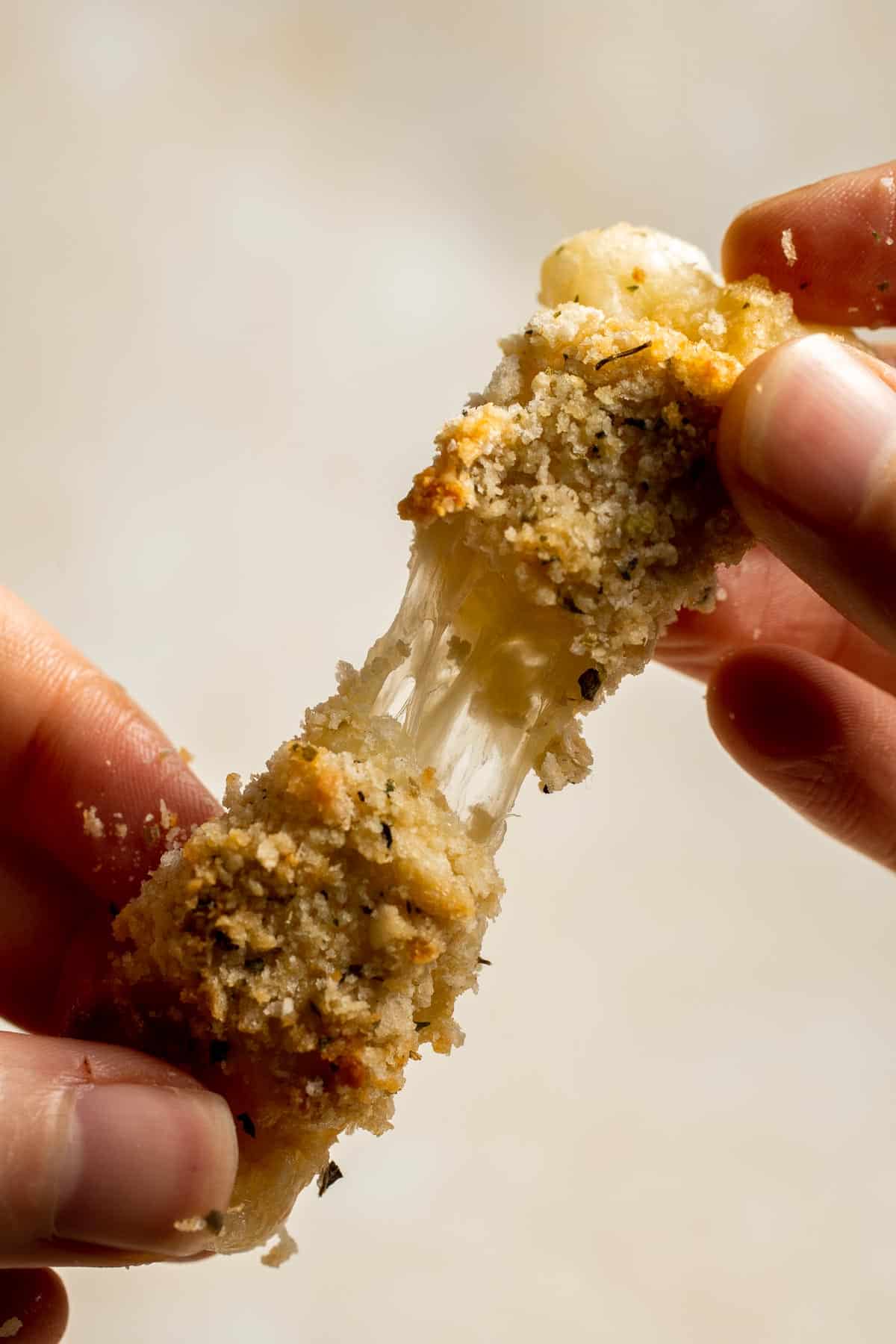 Baked Mozzarella Sticks are a cheesy appetizer that’s crispy on the outside and gooey on the inside. They’re baked instead of fried for a lighter twist. | aheadofthyme.com