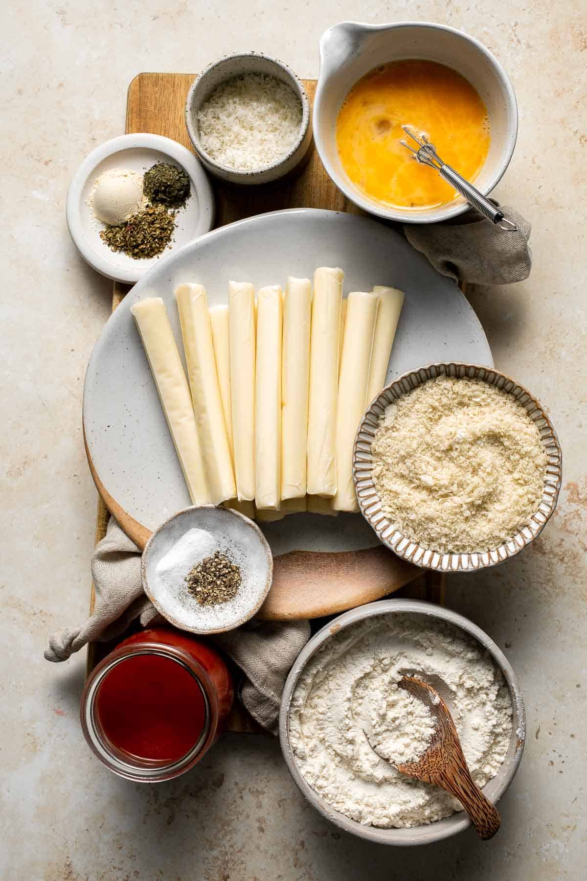 Baked Mozzarella Sticks are a cheesy appetizer that’s crispy on the outside and gooey on the inside. They’re baked instead of fried for a lighter twist. | aheadofthyme.com