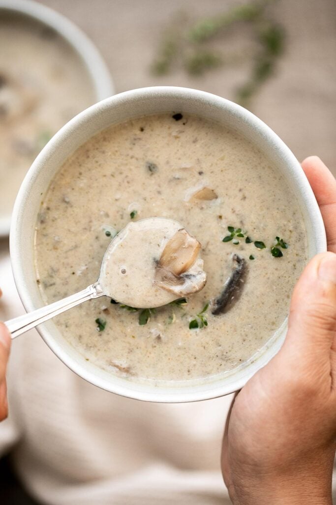 Cream of mushroom soup is thick, creamy, and comforting. This delicious one pot soup is easy to make in 45 minutes, freezer-friendly, and reheats well. | aheadofthyme.com