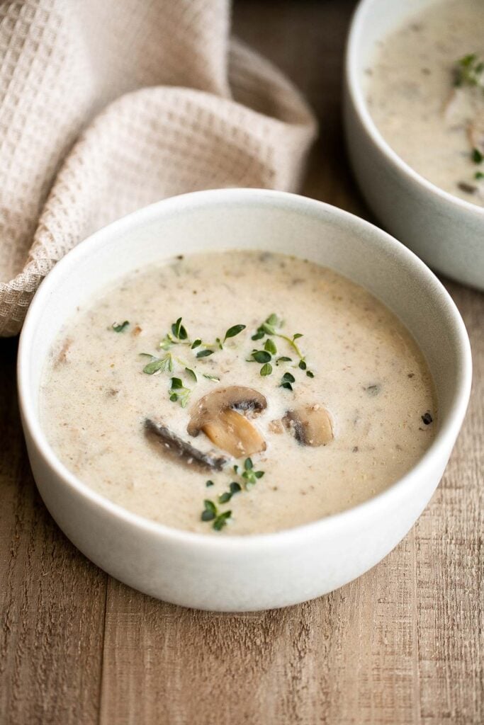 Cream of mushroom soup is thick, creamy, and comforting. This delicious one pot soup is easy to make in 45 minutes, freezer-friendly, and reheats well. | aheadofthyme.com