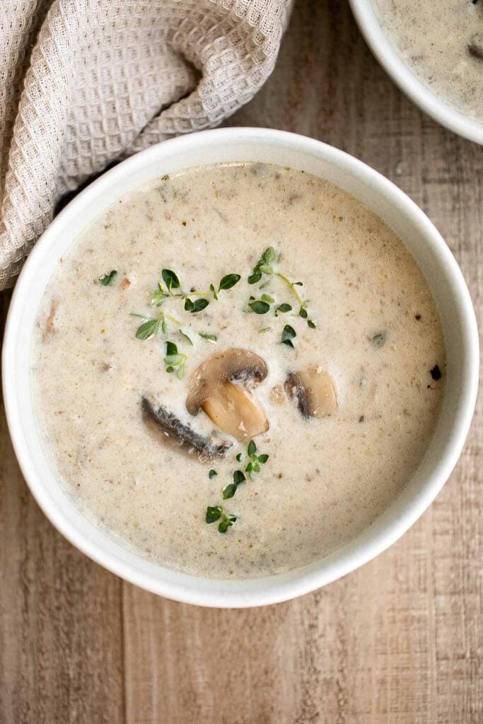 Cream of mushroom soup is thick, creamy, and comforting. This delicious one pot soup is easy to make in 45 minutes, freezer-friendly, and reheats well. | aheadofthyme.com