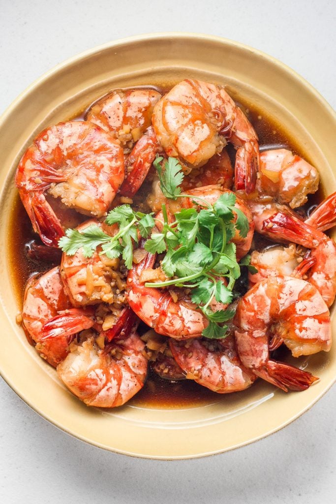 10-minute tiger prawns in garlic ginger soy sauce is juicy, tender and immersed in incredible Asian flavours. It's the perfect weeknight meal. | aheadofthyme.com