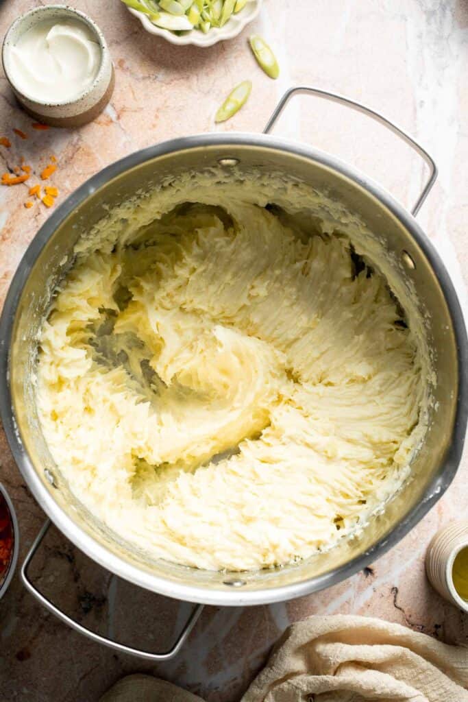 Baked mashed potato spring rolls combine creamy cheesy mashed potatoes with crispy golden wrappers for the ultimate JOEY copycat appetizer. | aheadofthyme.com