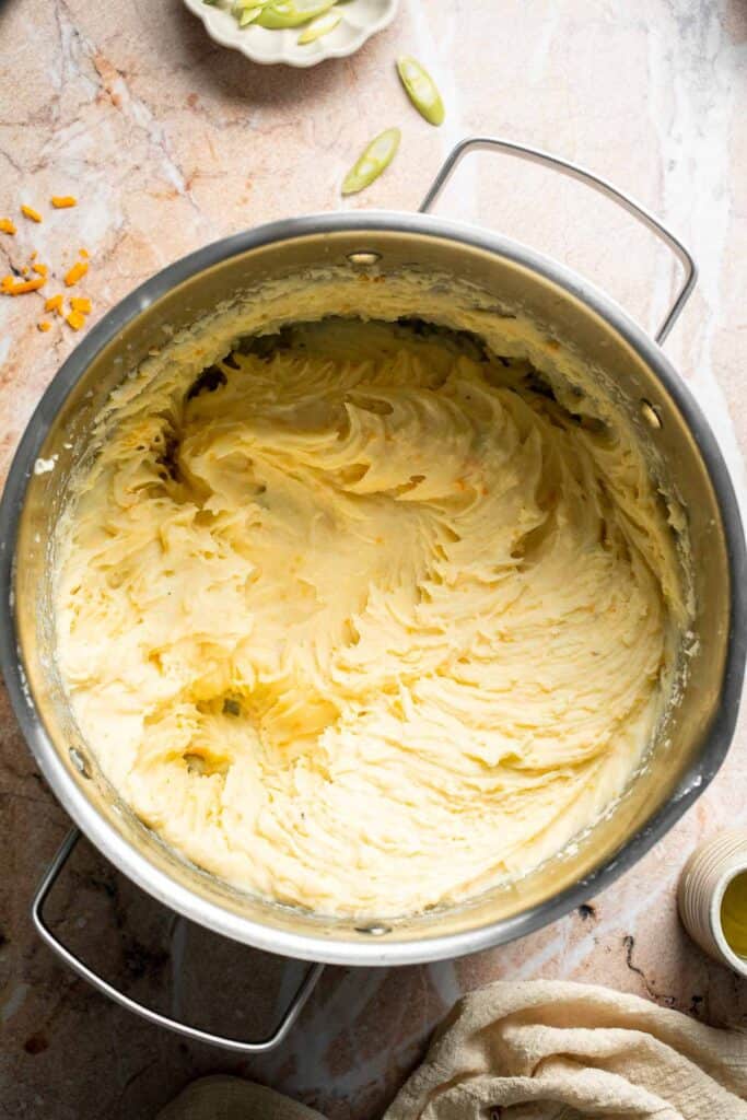 Baked mashed potato spring rolls combine creamy cheesy mashed potatoes with crispy golden wrappers for the ultimate JOEY copycat appetizer. | aheadofthyme.com