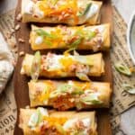 Baked mashed potato spring rolls combine creamy cheesy mashed potatoes with crispy golden wrappers for the ultimate JOEY copycat appetizer. | aheadofthyme.com