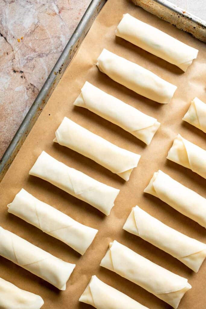 Baked mashed potato spring rolls combine creamy cheesy mashed potatoes with crispy golden wrappers for the ultimate JOEY copycat appetizer. | aheadofthyme.com