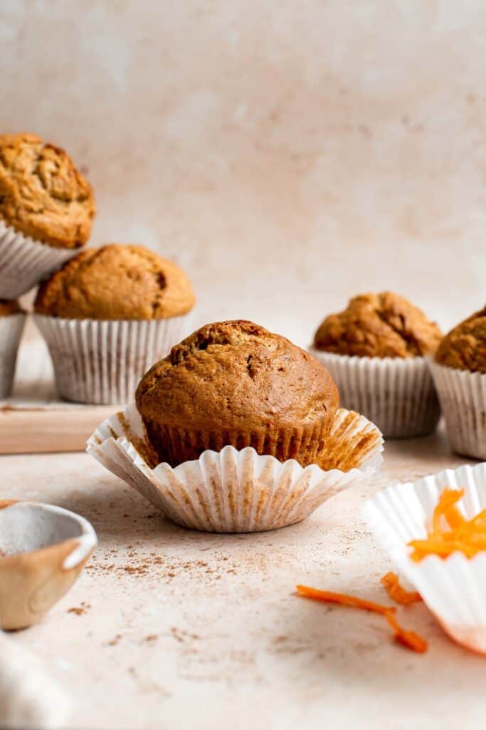 Carrot cake muffins are moist, light, chewy and full of carrots which means breakfast this week is healthy! Carrot muffins are great for meal prep too. | aheadofthyme.com