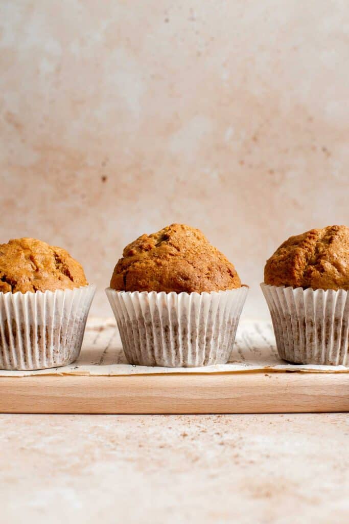 Carrot cake muffins are moist, light, chewy and full of carrots which means breakfast this week is healthy! Carrot muffins are great for meal prep too. | aheadofthyme.com